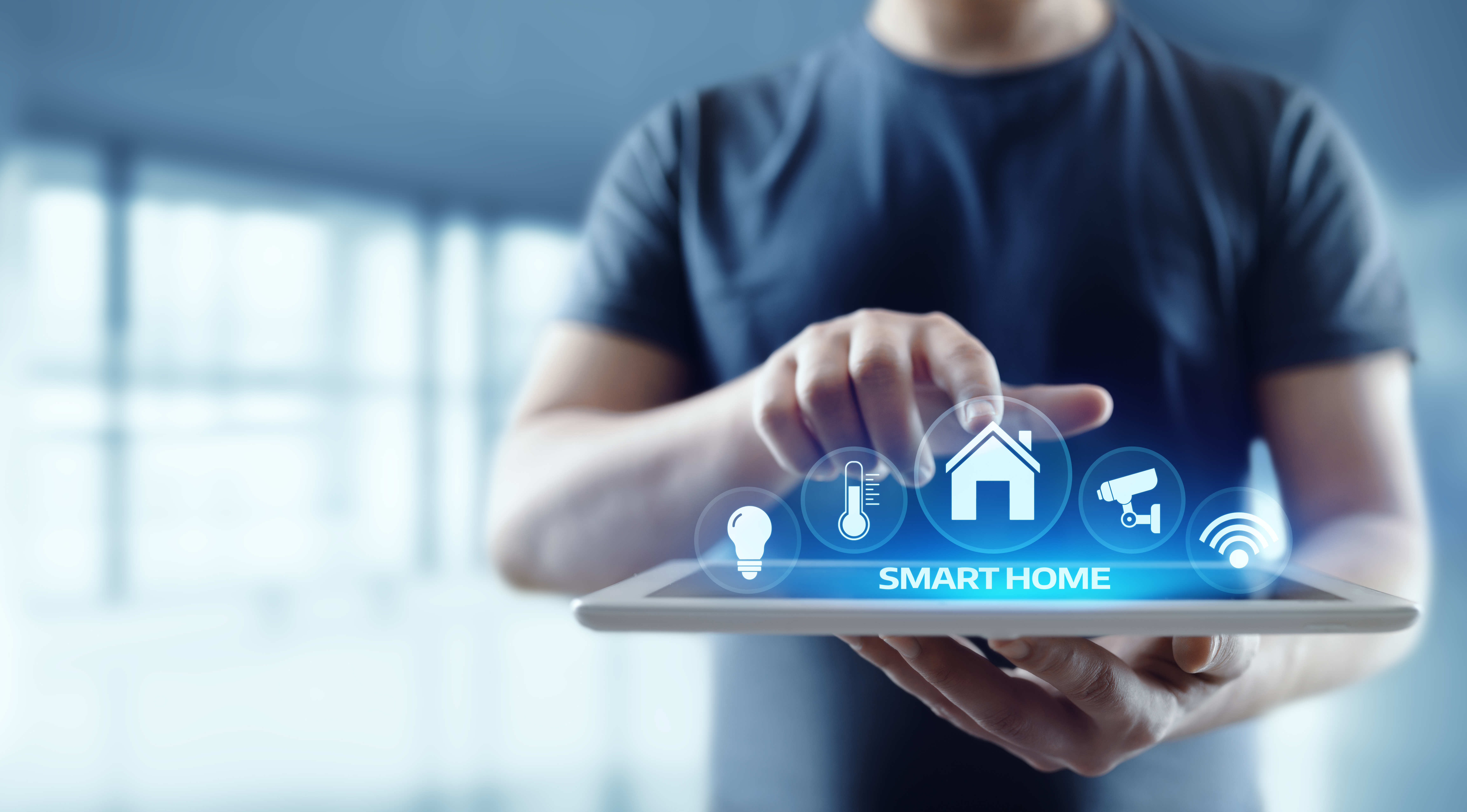 man-tablet-ipad-technology-IoT-home-smart